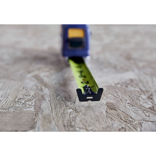 IRWIN (R) TRADE STRONG (TM) Strait-Line (R) Tape in Environment Showing XL Hook Feature in Application on Wood Material